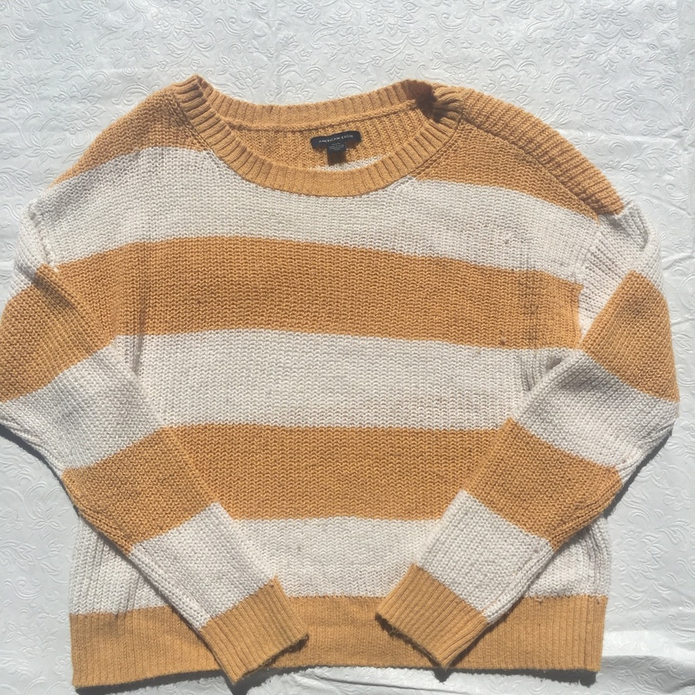 White and orange striped sweater